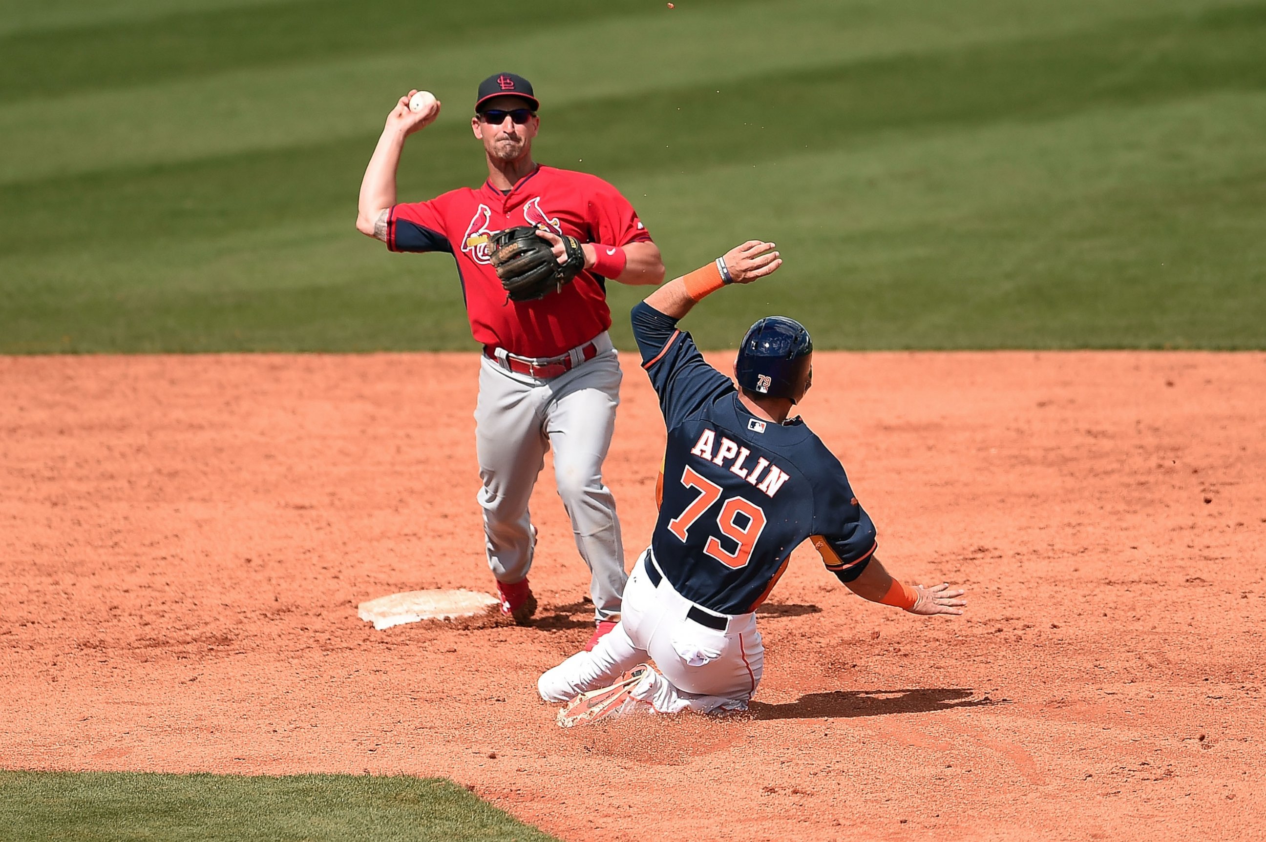 PHOTO: Andrew Aplin of the Houston Astros is tagged out at second base by Dean Anna of the St. Louis Cardinals during a spring training game at Osceola County Stadium on March 10, 2015 in Kissimmee, Fla.