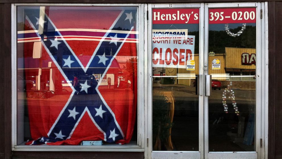 PHOTO: A Confederate flag covers a window of a store in a small town in Georgia on June 21, 2015.