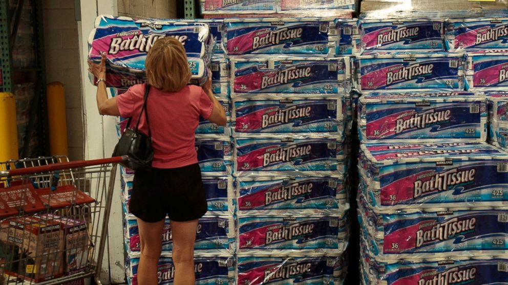 A shopper grabs a bulk package of toilet paper at a Costco store April 4, 2008 in Tucson, Ariz.