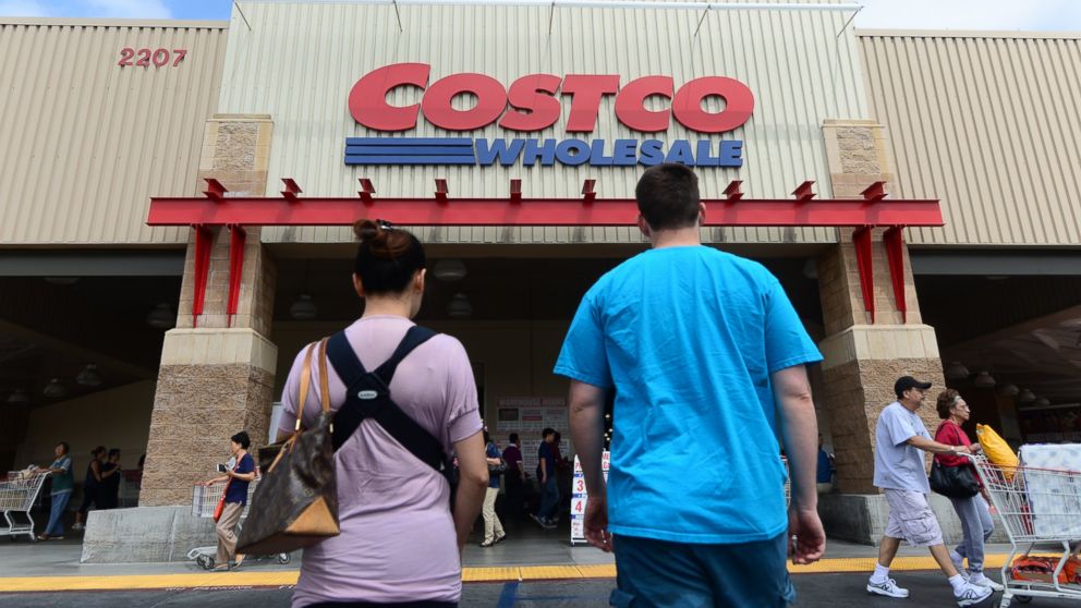 A couple make their way toward the entrance of a Costco store in Alhambra, Calif. on June 2, 2013.