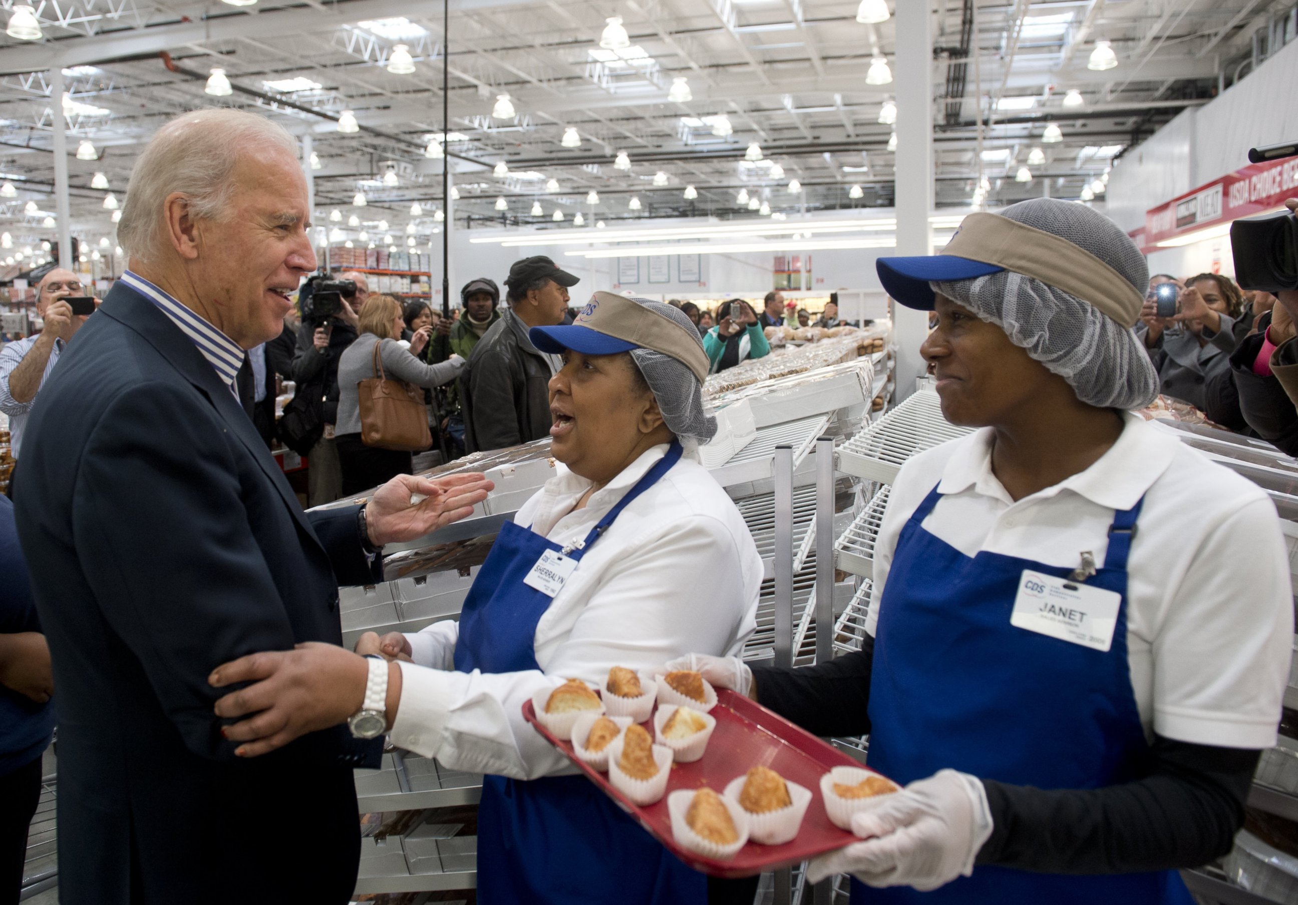 PHOTO: Vice President Joe Biden tries food samples during a visit to a Costco store on a shopping trip in Washington, DC, on Nov. 29, 2012.