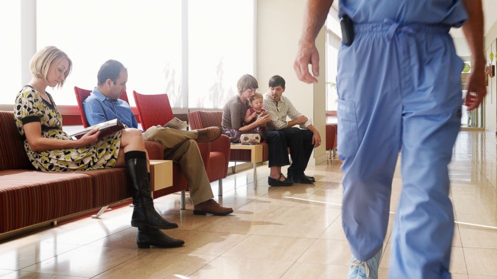 People waiting for medical care in this stock photo. 