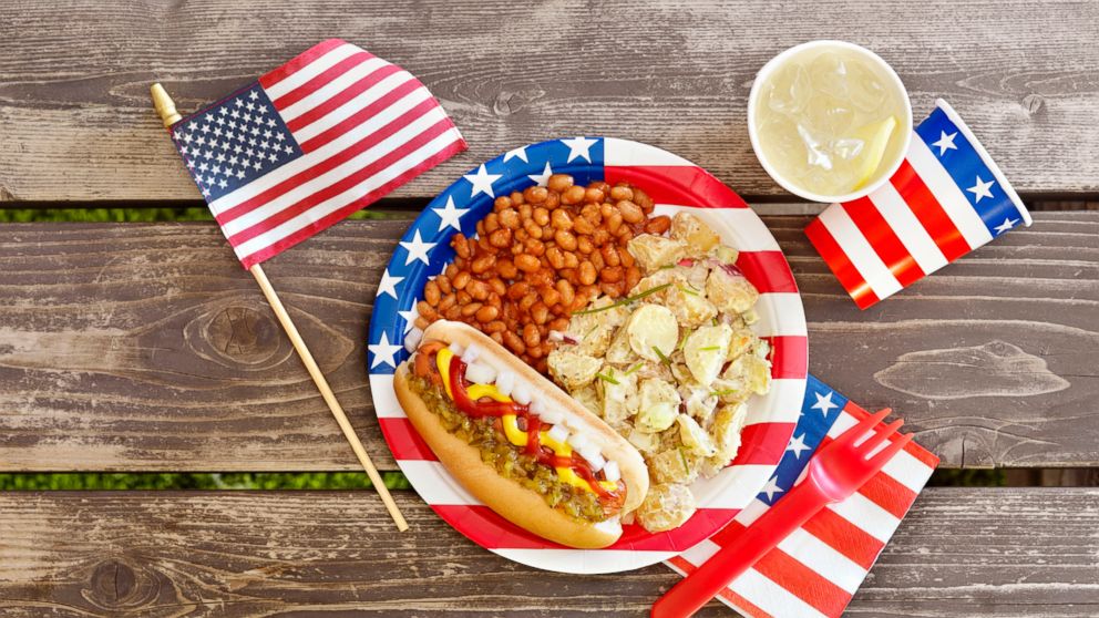 A patriotic picnic place setting and American flag are seen in this undated stock photo.