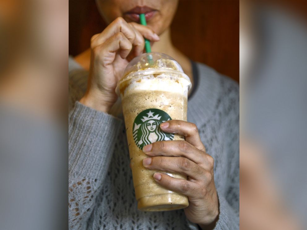 PHOTO: A woman takes a drink from a 26-ounce  Caramel Frappuccino at a Starbucks on the Upper East Side of New York, March 11, 2013.