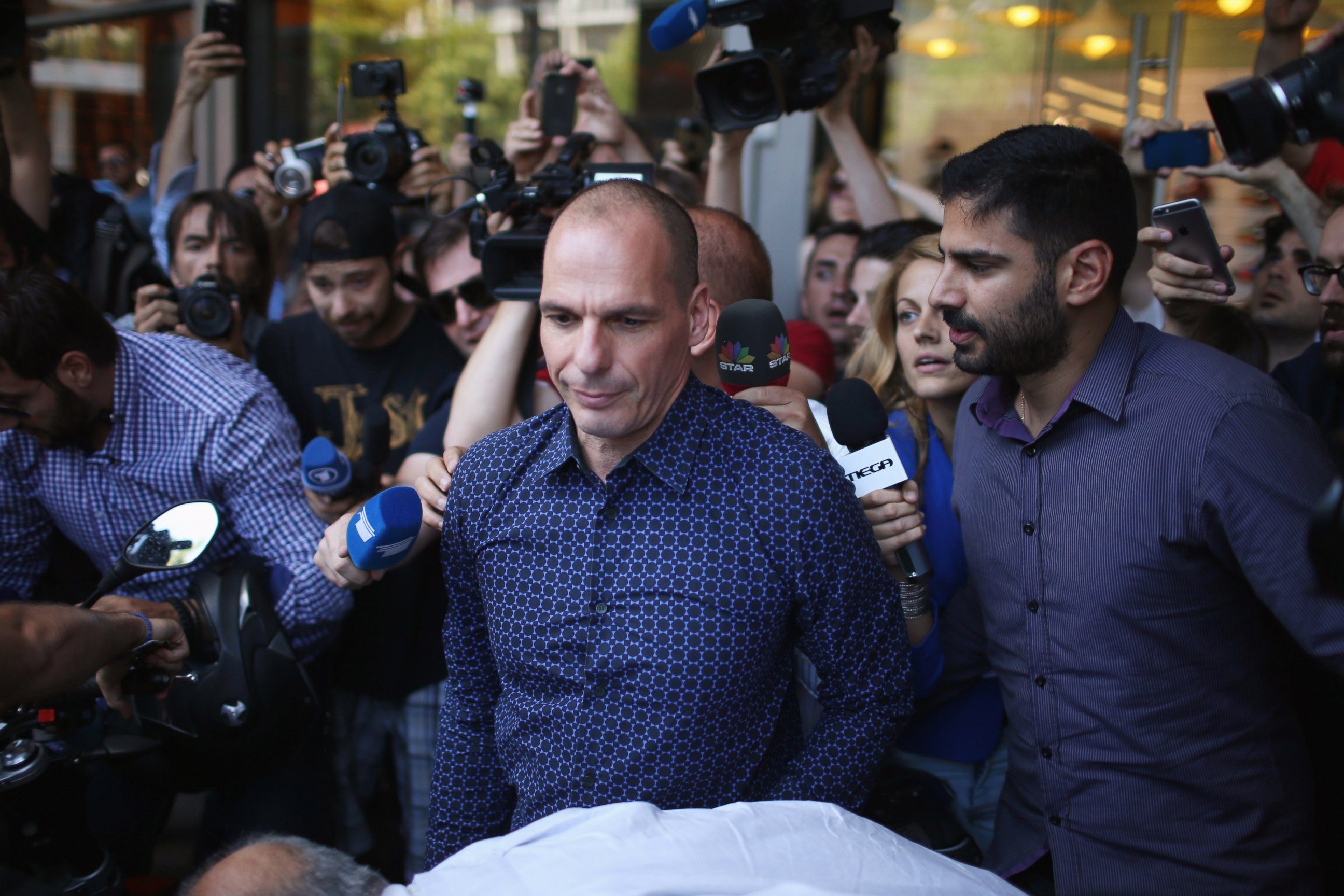PHOTO: Former Greek finance minister Yanis Varoufakis faces the media as he leaves the finance ministry after resigning this morning on July 6, 2015 in Athens, Greece. 