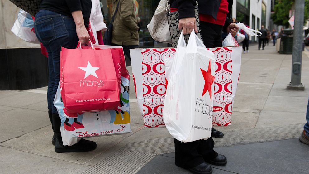 Pedestrians carry shopping bags on Black Friday in San Francisco, California, U.S., in this Nov. 25, 2011 file photo.