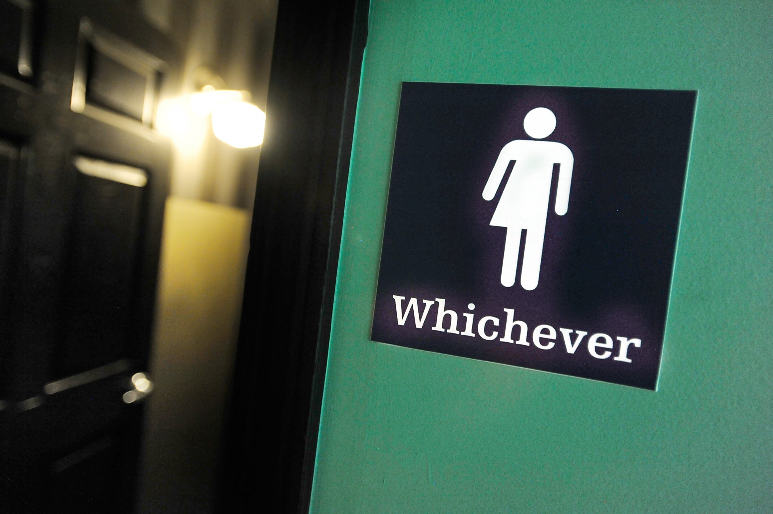 PHOTO: A gender neutral sign is posted outside a bathrooms at Oval Park Grill on May 11, 2016 in Durham, North Carolina.