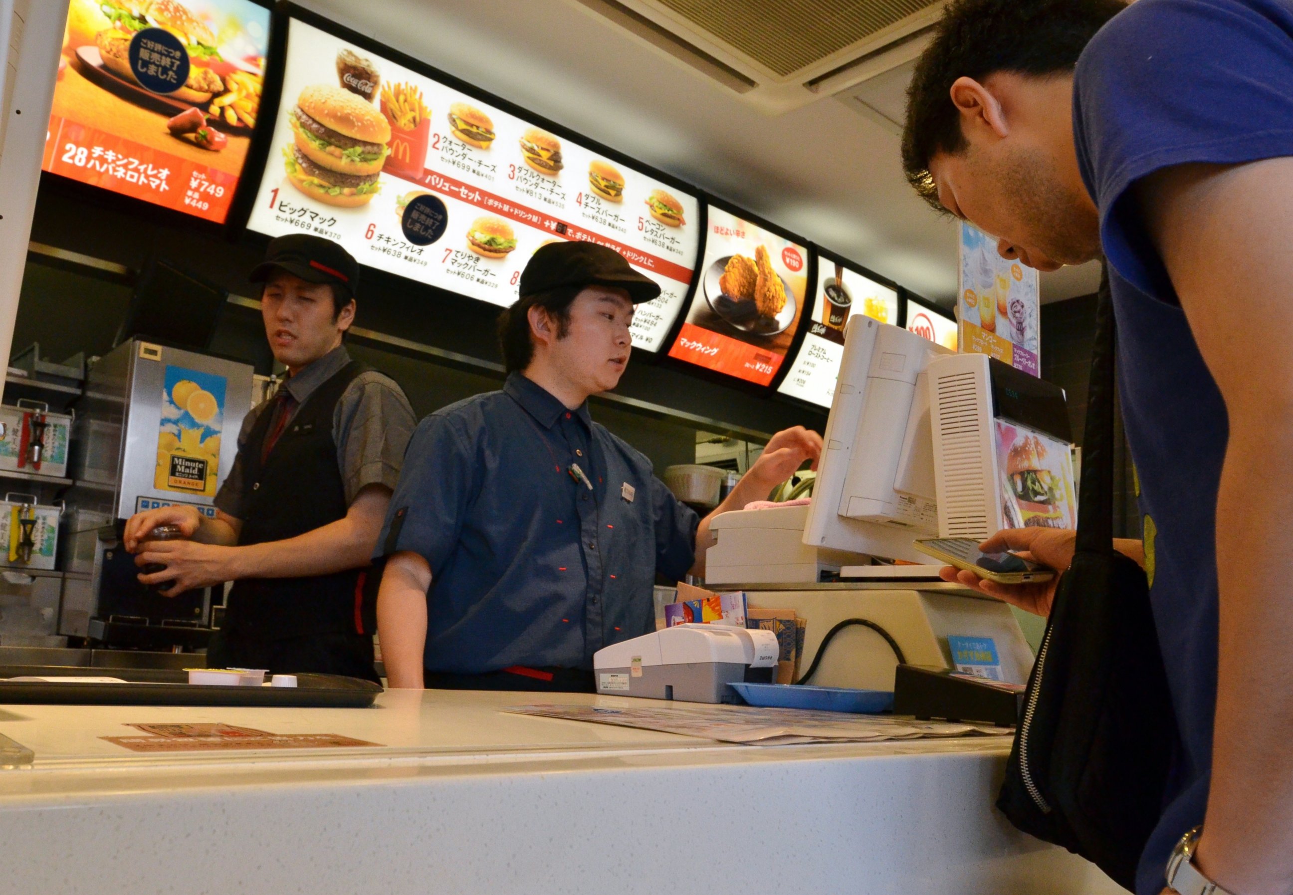 PHOTO: A customer orders food at a McDonald's restaurant in Tokyo, July 25, 2014. 