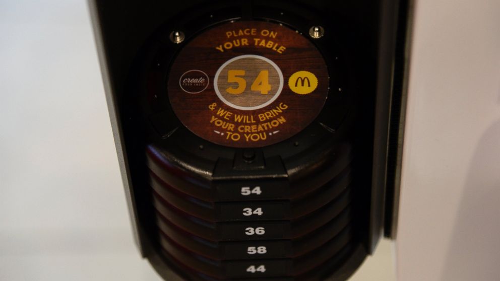 PHOTO: Electronic pucks are available for customers to take to their tables at the ordering kiosk at a new concept McDonalds at in Aurora, Colo., Aug. 26, 2015.