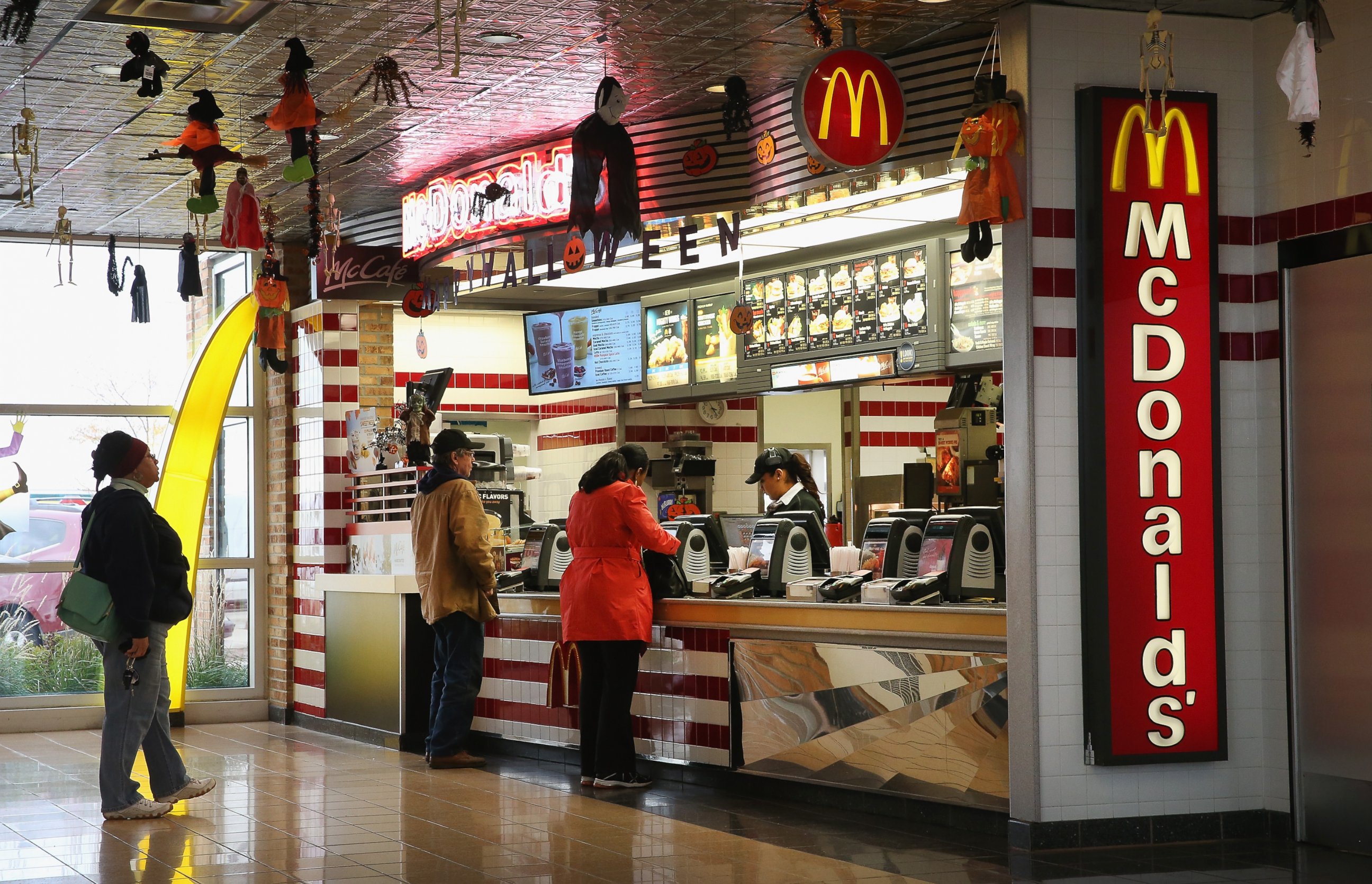 PHOTO: Customers order food from a McDonald's restaurant on Oct. 24, 2013 in Des Plaines, Ill.