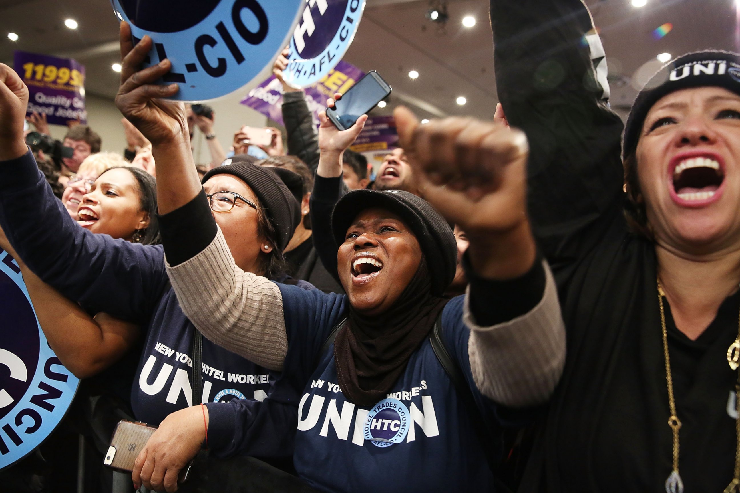 PHOTO: People cheer as Democratic presidential candidate Hillary Clinton joins New York Governor Andrew Cuomo at a rally on April 4, 2016 in New York City.