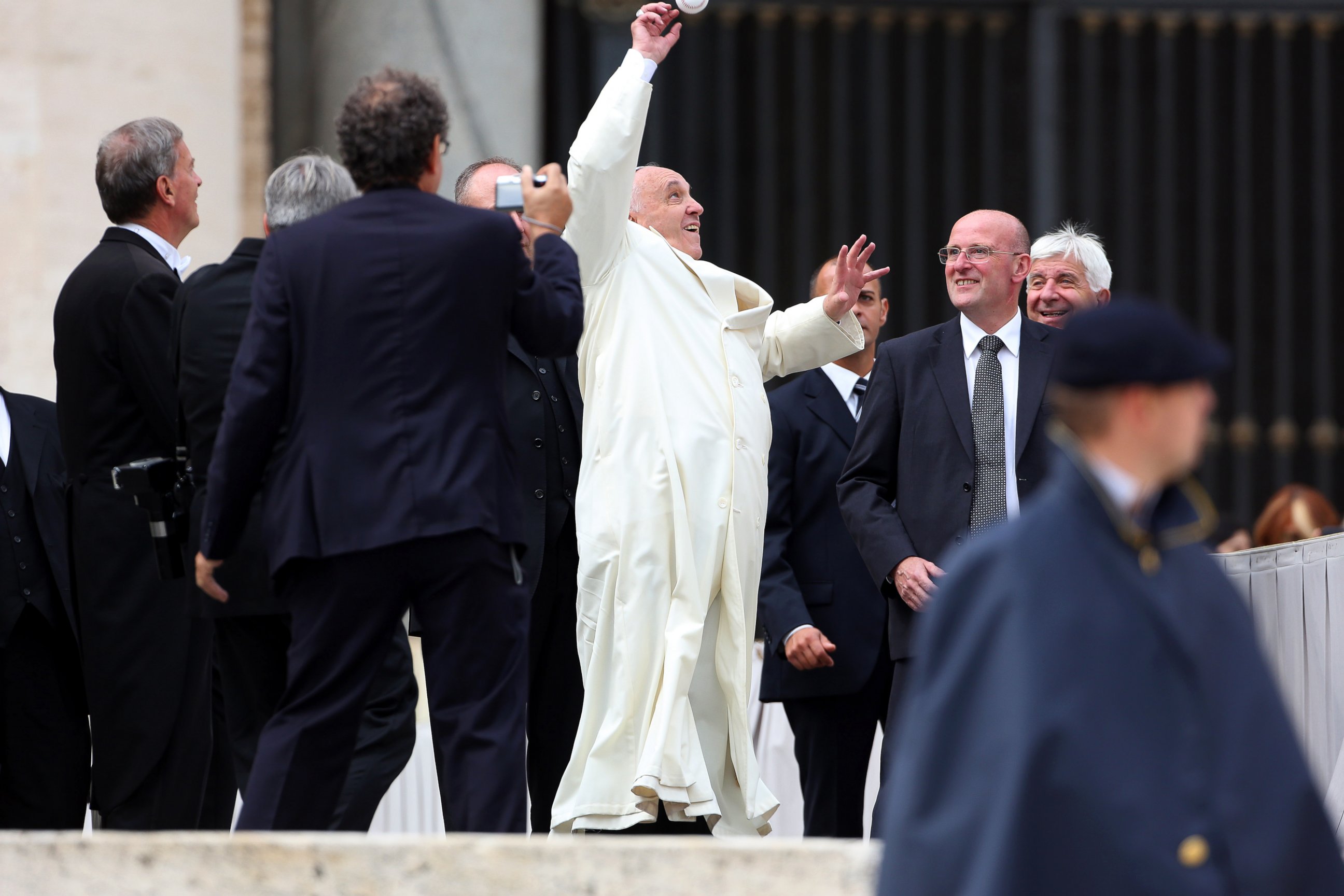 PHOTO: Pope Francis jumps to catch a baseball ball thrown by a faithful at the end of his weekly audience at St. Peter's Square on Sept. 24, 2014 in Vatican City, Vatican.