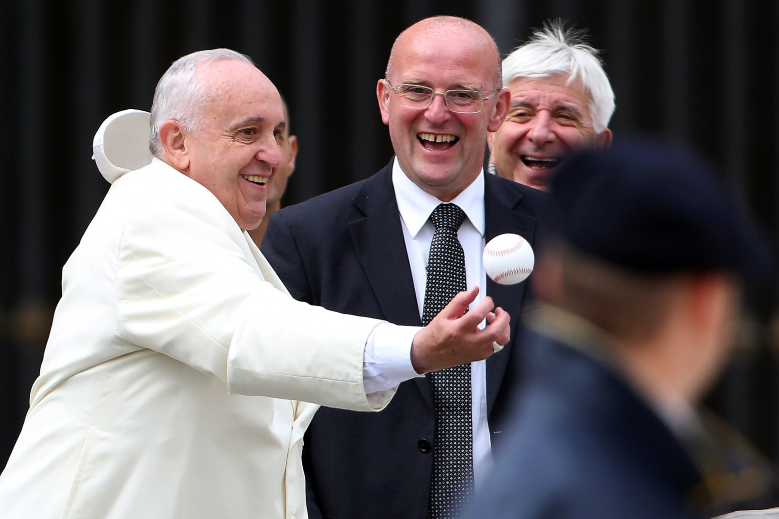 PHOTO: Pope Francis loses his 'papalina' cup as he reaches to catch a baseball ball thrown by a faithful at the end of his weekly audience at St. Peter's Square on Sept. 24, 2014 in Vatican City, Vatican.