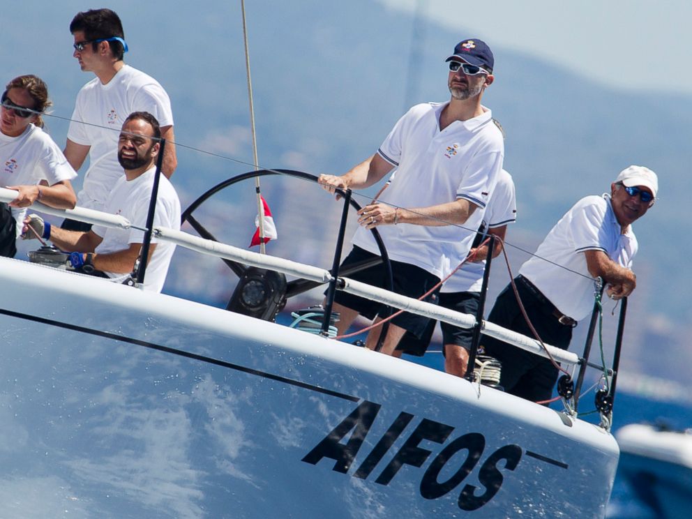 PHOTO: Spains Crown Prince Felipe, second right, steers the Aifos sailboat during the 32nd Copa del Rey Regatta off the coast of Palma de Mallorca on July 31, 2013.