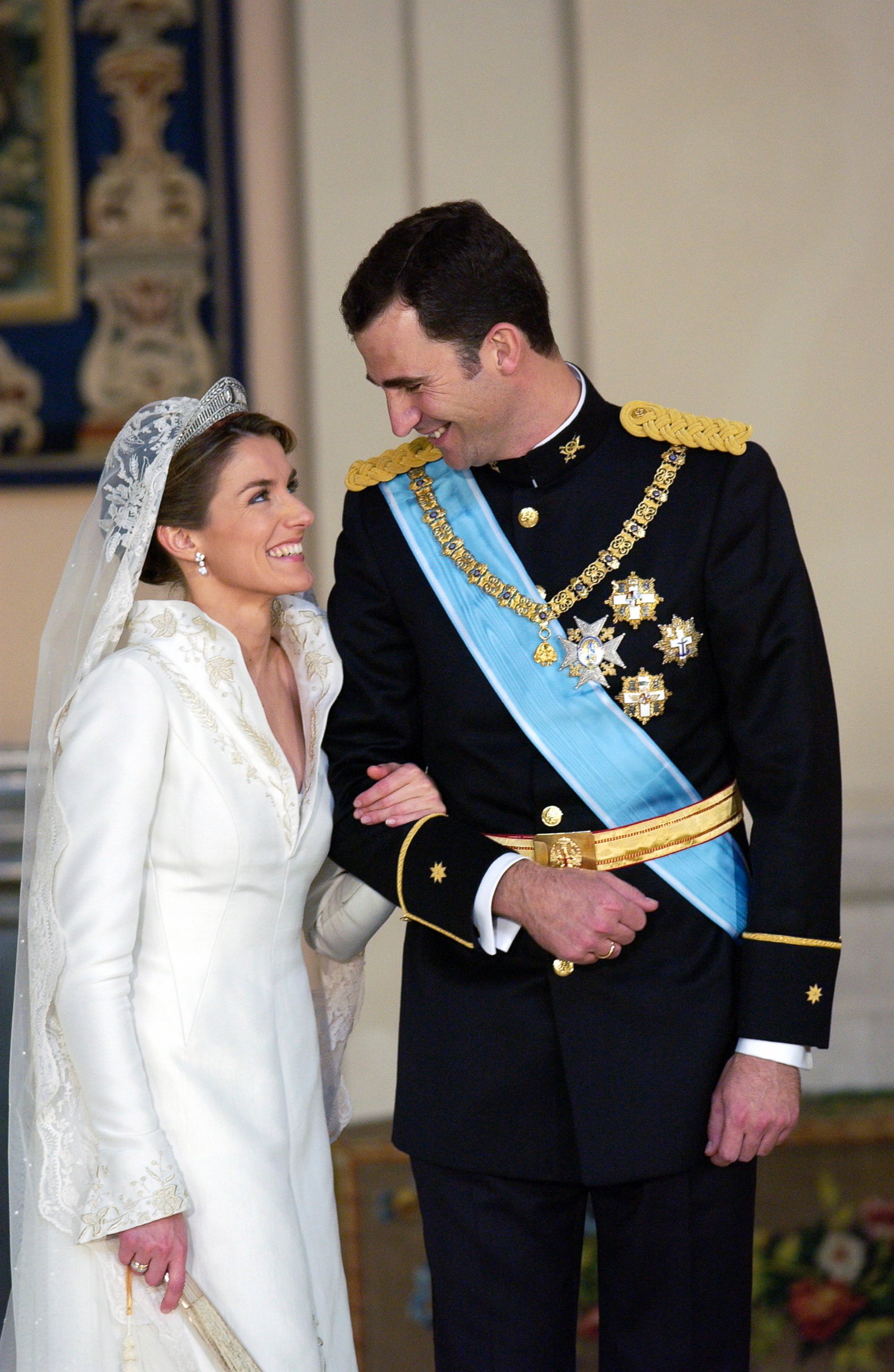 PHOTO: Crown Prince Felipe Of Spain, Prince Of The Asturias, laughing with his bride Crown Princess Letizia in the royal palace after their wedding, May 22, 2004. 