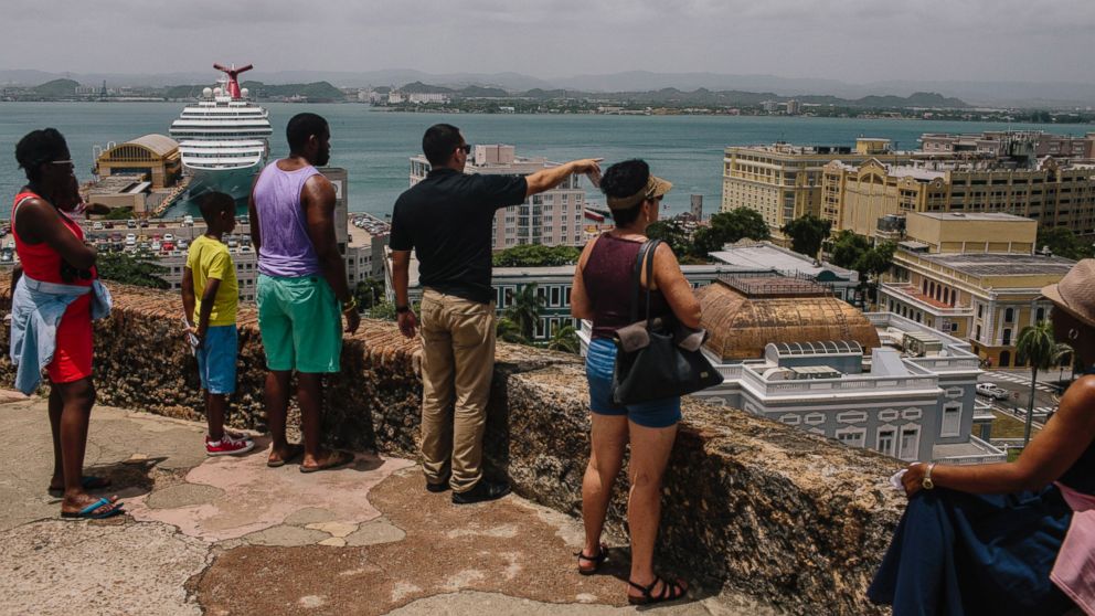 PHOTO: People look out over the Old City of San Juan, Puerto Rico, on July 8, 2015.