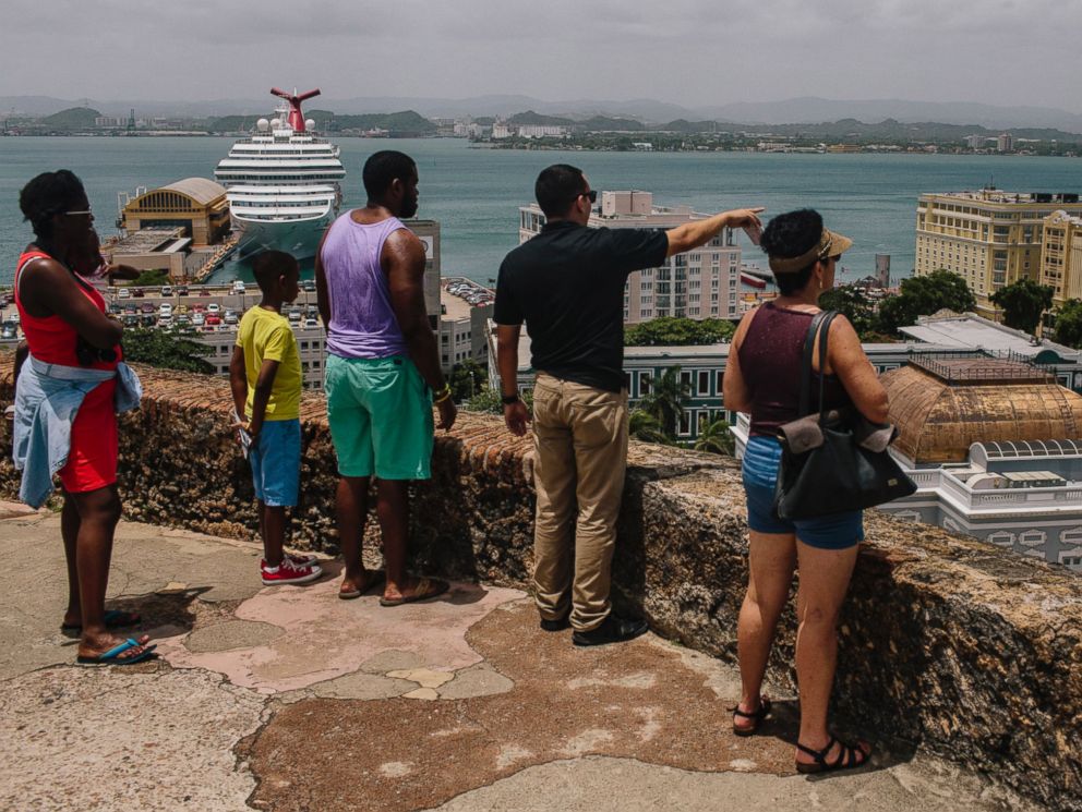 PHOTO: People look out over the Old City of San Juan, Puerto Rico, on July 8, 2015.