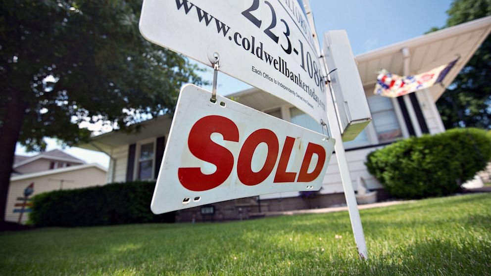 A "sold" sign stands outside a home in LaSalle, Ill., in this June 7, 2013 photo.