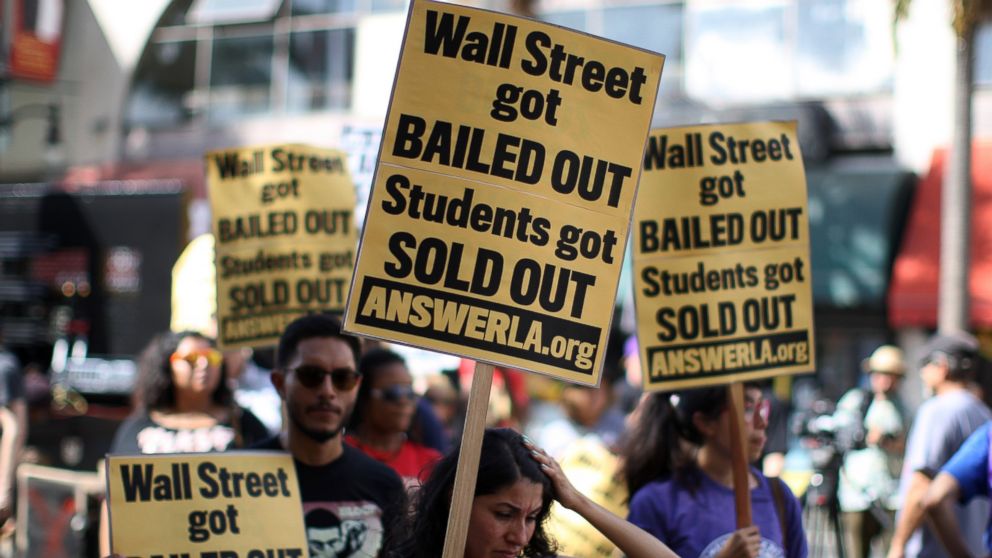 In this Sept. 22, 2012 fiel photo, students protest the rising costs of student loans for higher education in the Hollywood section of Los Angeles, California. 