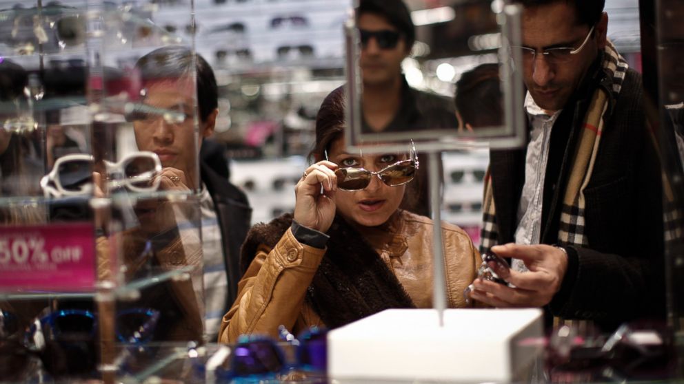 PHOTO: Customers shop for sun glasses at Macy's Herald Square after the store opened its doors at 8pm  Thanksgiving day on Nov. 28, 2013 in New York City.