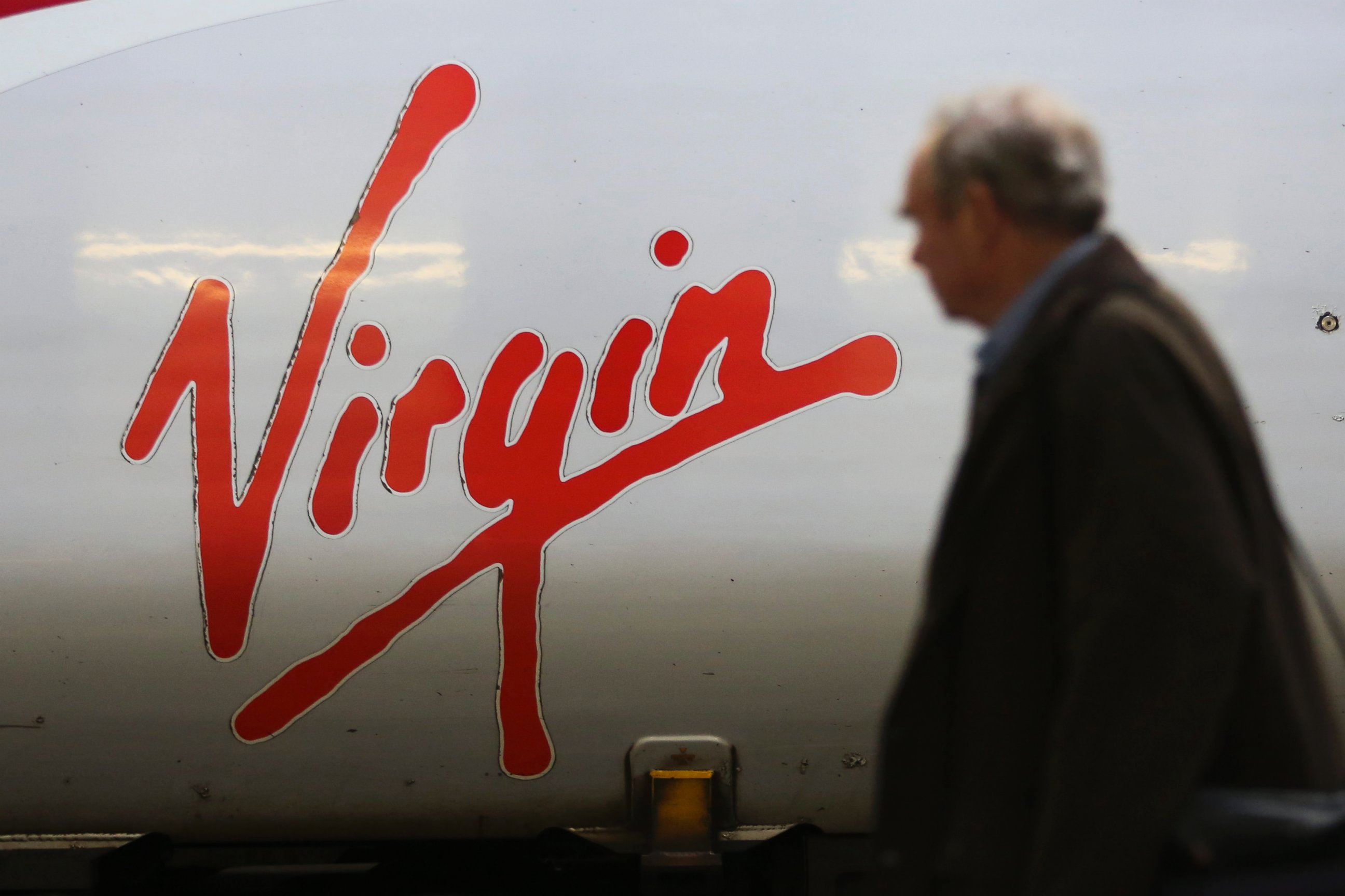 PHOTO: The Virgin logo sits on the side of a West Coast train, operated by Virgin Trains, as it stands beside a platform at Euston railway station in London, Nov. 27, 2014. 