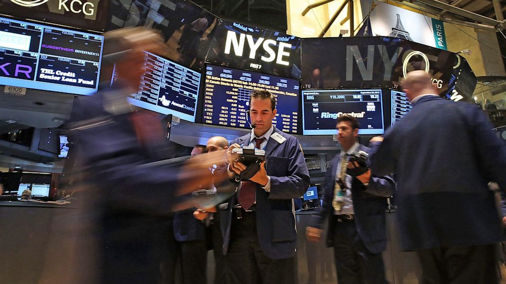 Traders work on the floor of the New York Stock Exchange during morning trading, Sept. 30, 2013 in New York.