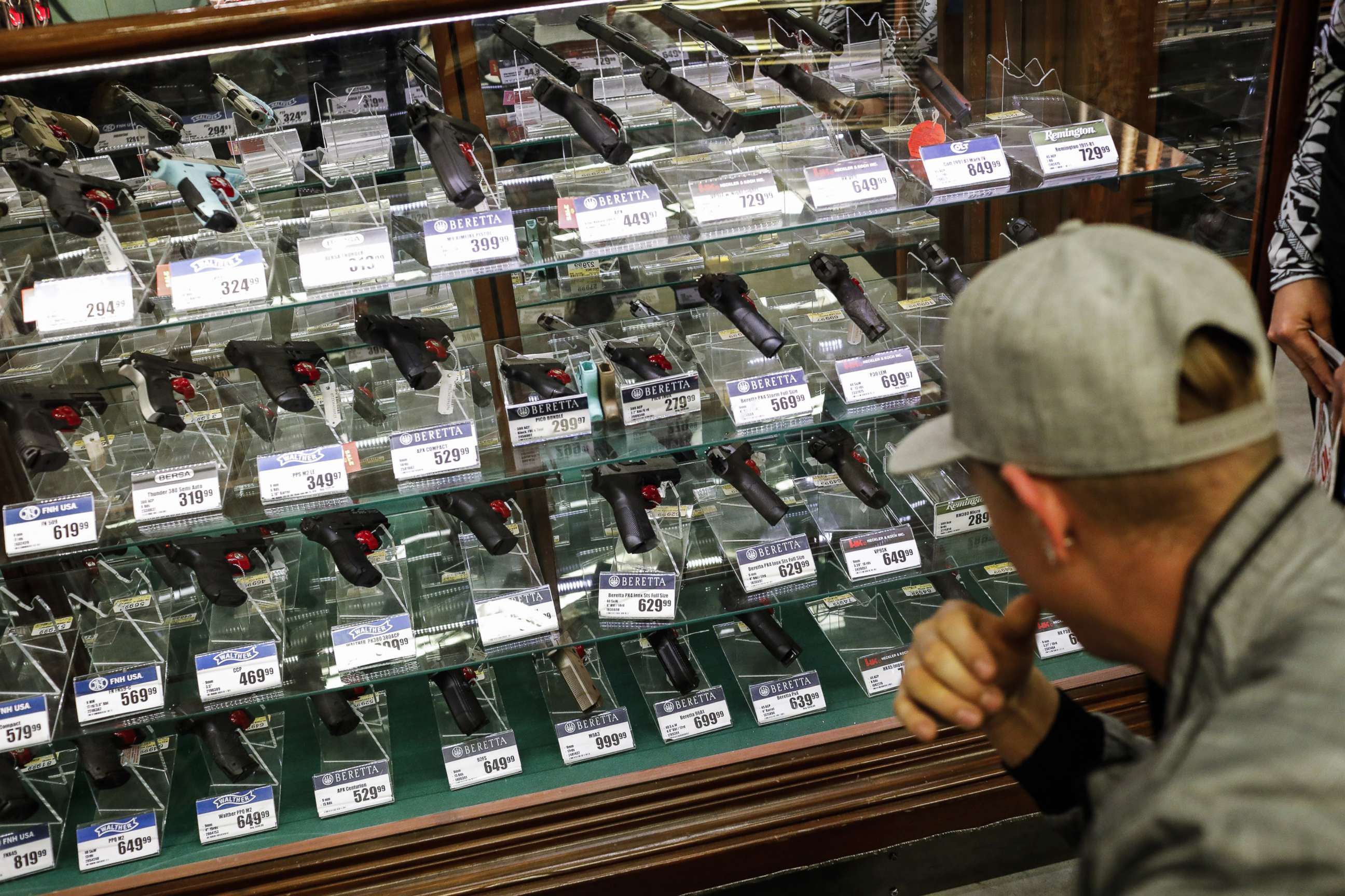PHOTO: A shopper browses handheld firearms for sale inside a Bass Pro Outdoor World LLC store on Black Friday in Tampa, Fla., Nov. 23, 2018.