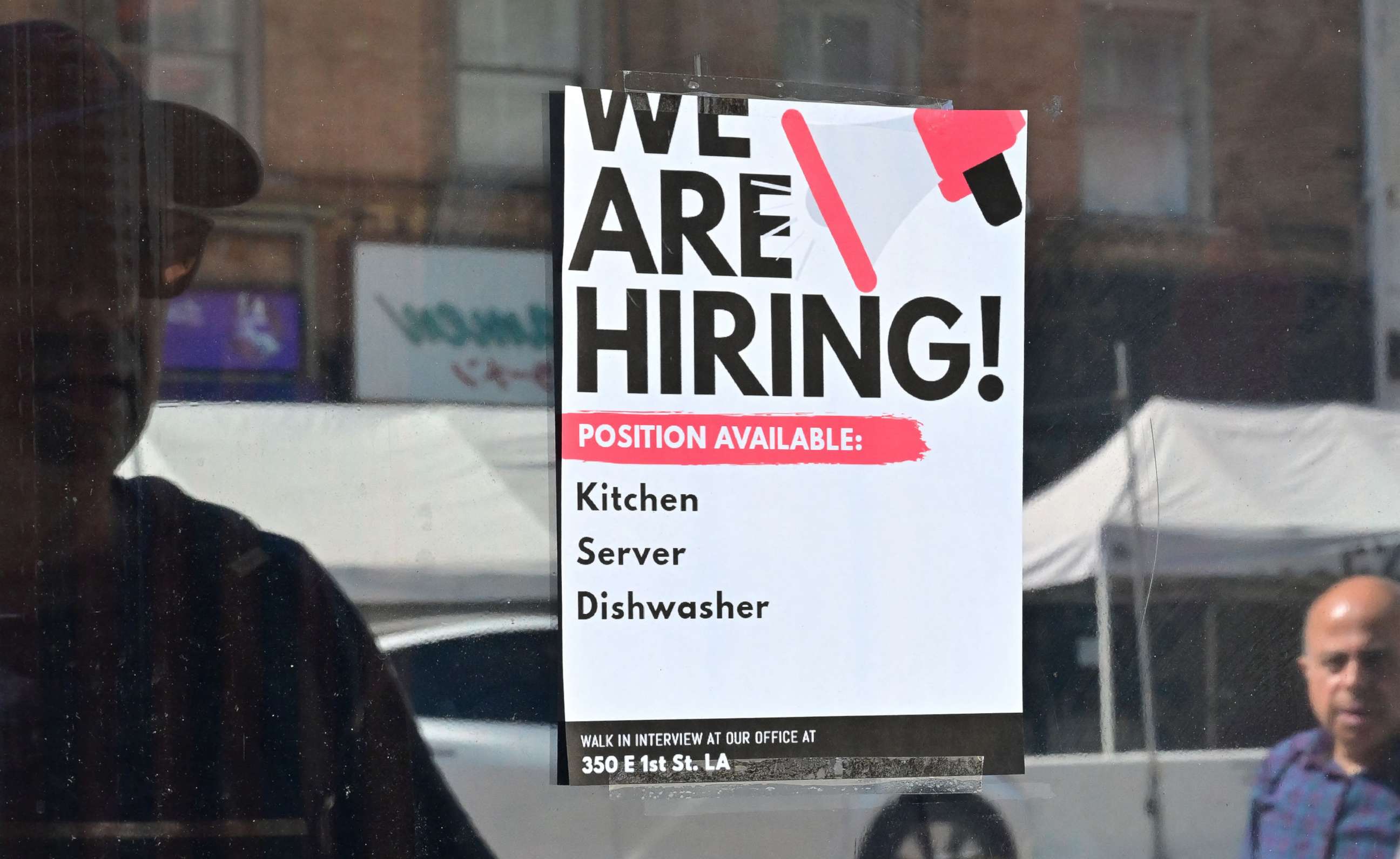 PHOTO: A "We Are Hiring" sign is posted in front of a restaurant in Los Angeles.
