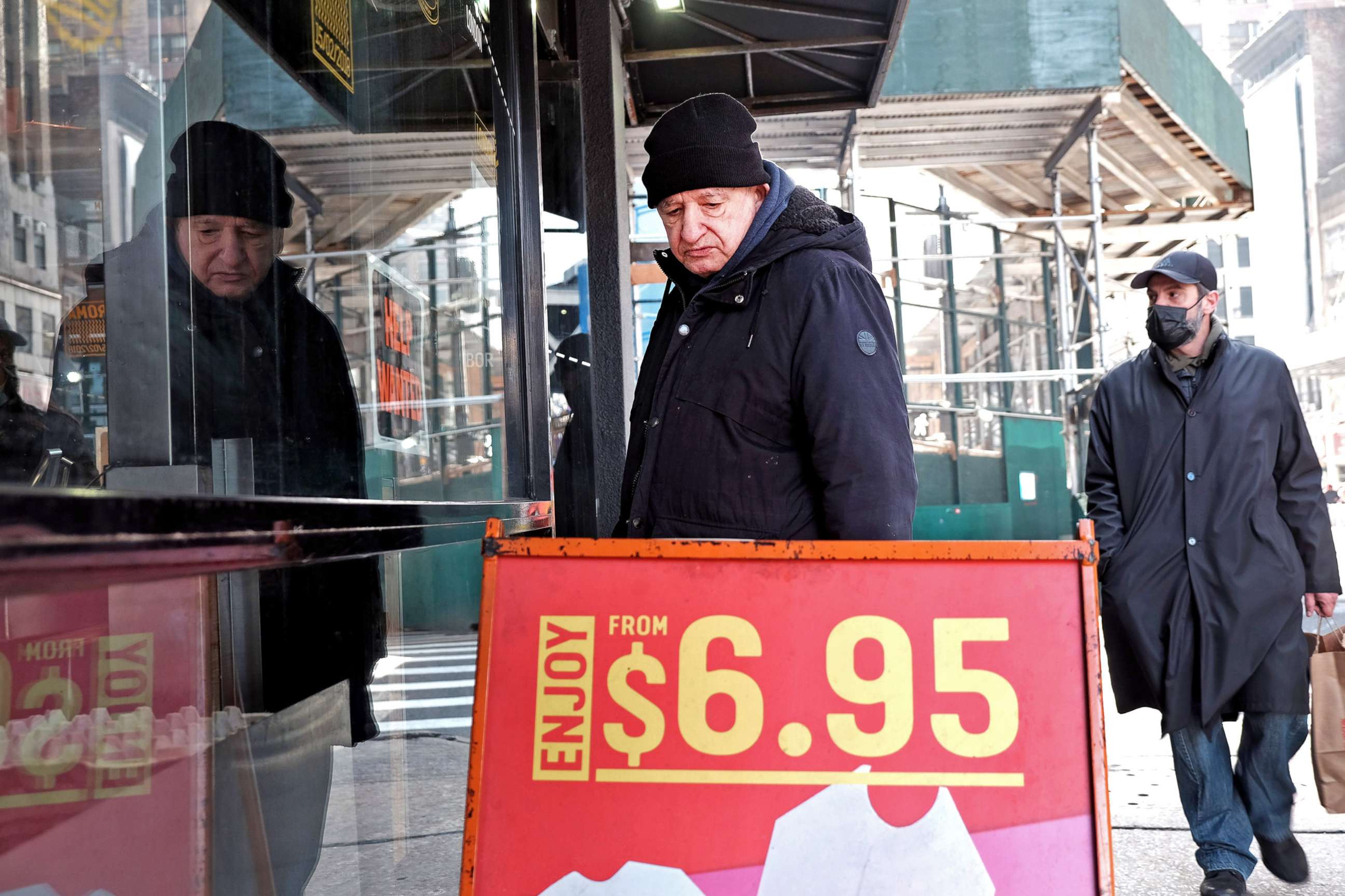 PHOTO: Prices are displayed outside of a Manhattan business on Jan. 12, 2022 in New York City. Newly released data shows that inflation growth, as prices rose on everything from gas to furniture for American shoppers.