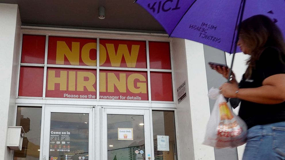 PHOTO: A sign reading, "Now Hiring" hangs above the entrance to a McDonald's restaurant on Nov. 5, 2021, in Miami Beach, Fla. 