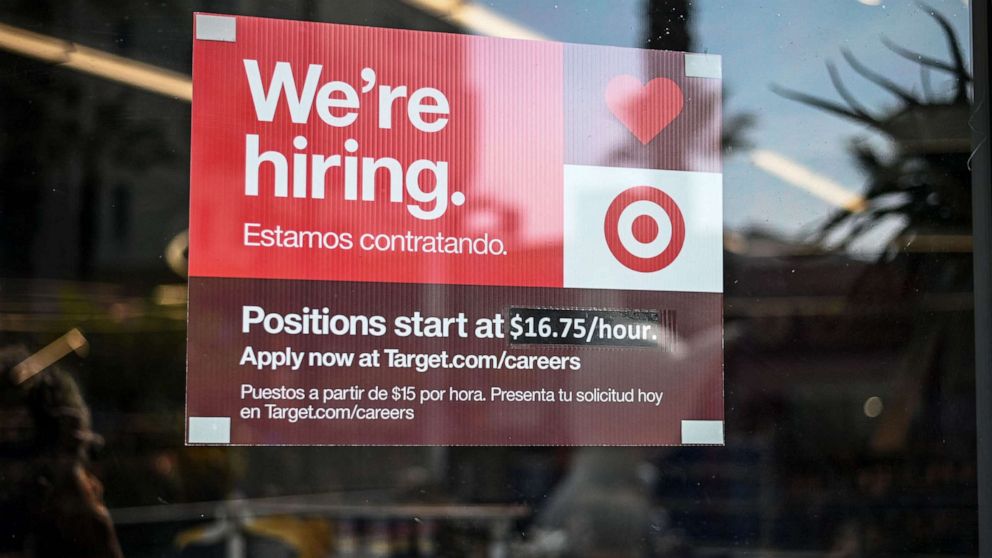 PHOTO: A sign advertising for new employees with an updated starting salary of $16.75 per hour is seen in the window of a Target store in Hollywood, Calif., Nov. 9, 2021.