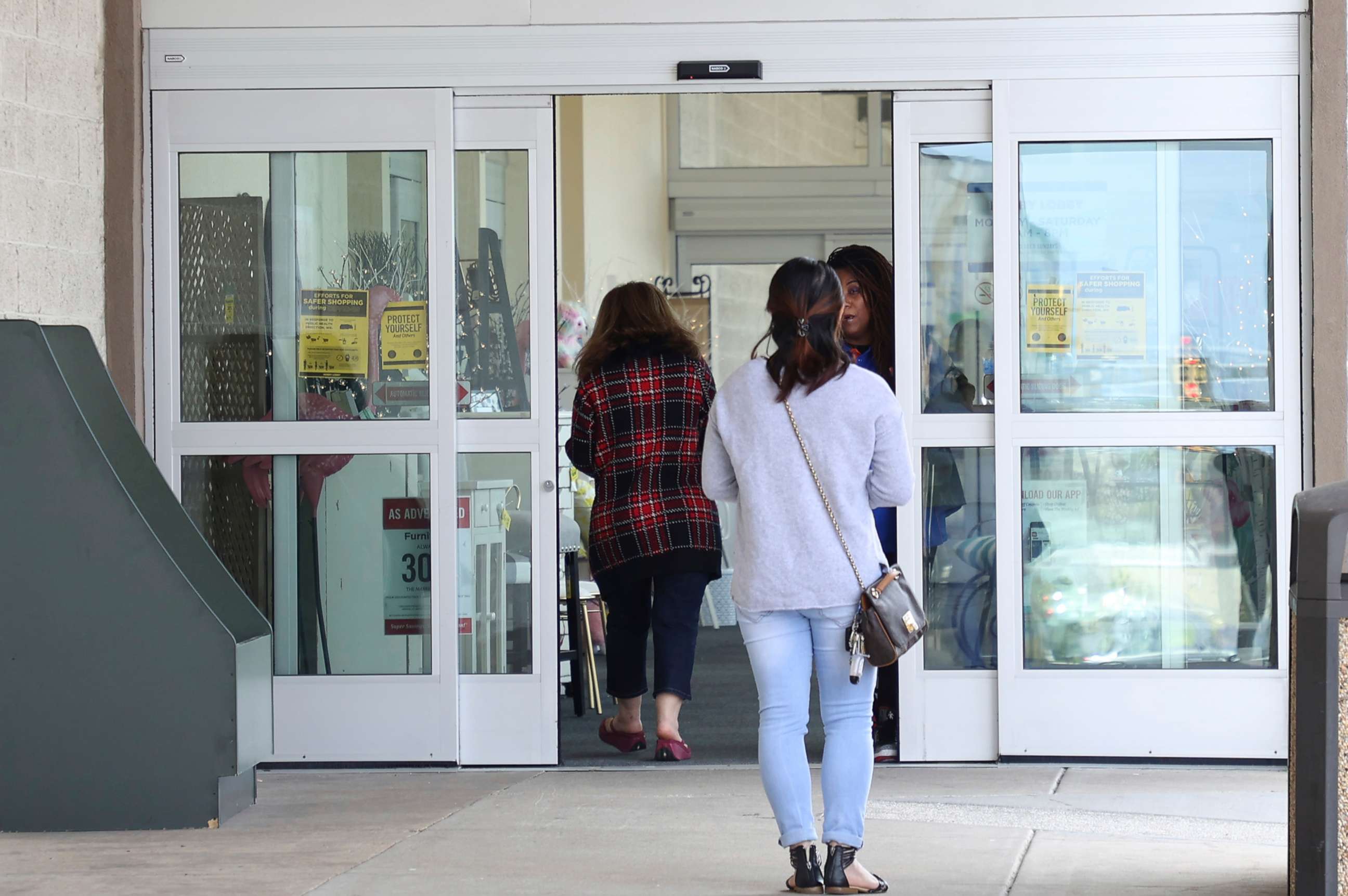 PHOTO: People enter a Hobby Lobby store in Woodbridge, Va., April 1, 2020.