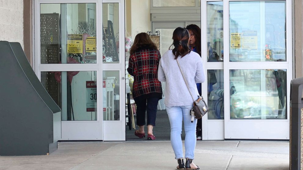PHOTO: People enter a Hobby Lobby store in Woodbridge, Va., April 1, 2020.