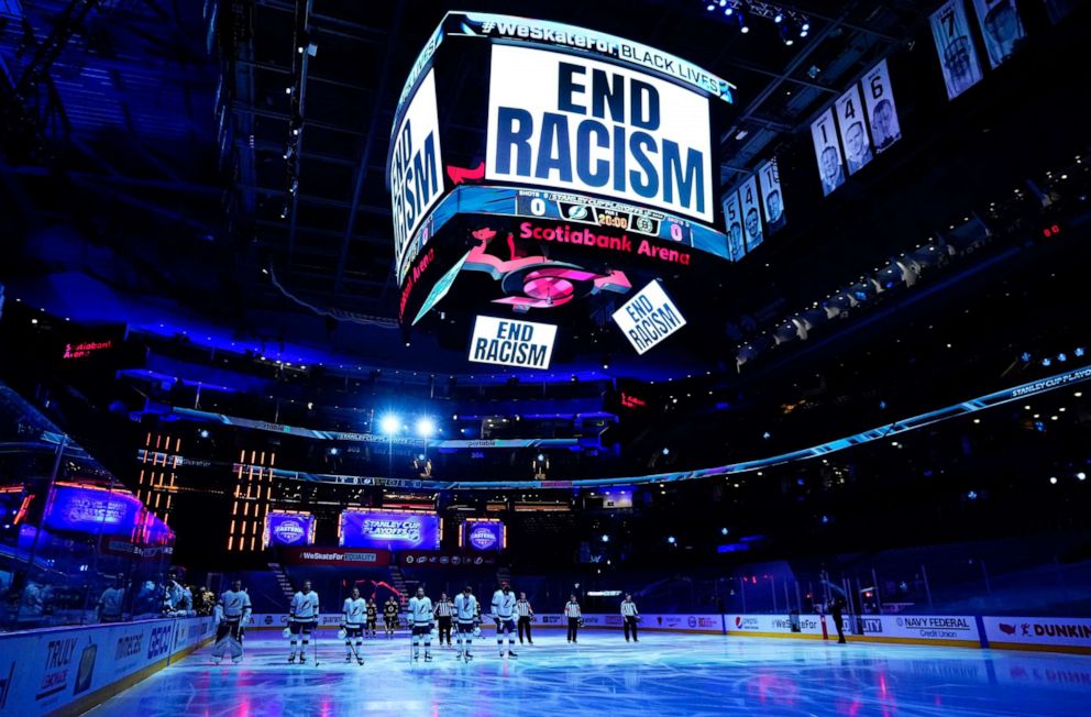 PHOTO: An "End Racism" message is displayed prior to the start of Game Three of the Eastern Conference Second Round between the Tampa Bay Lightning and the Boston Bruins during the NHL Stanley Cup Playoffs at Scotiabank Arena on Aug. 26, 2020, in Toronto.