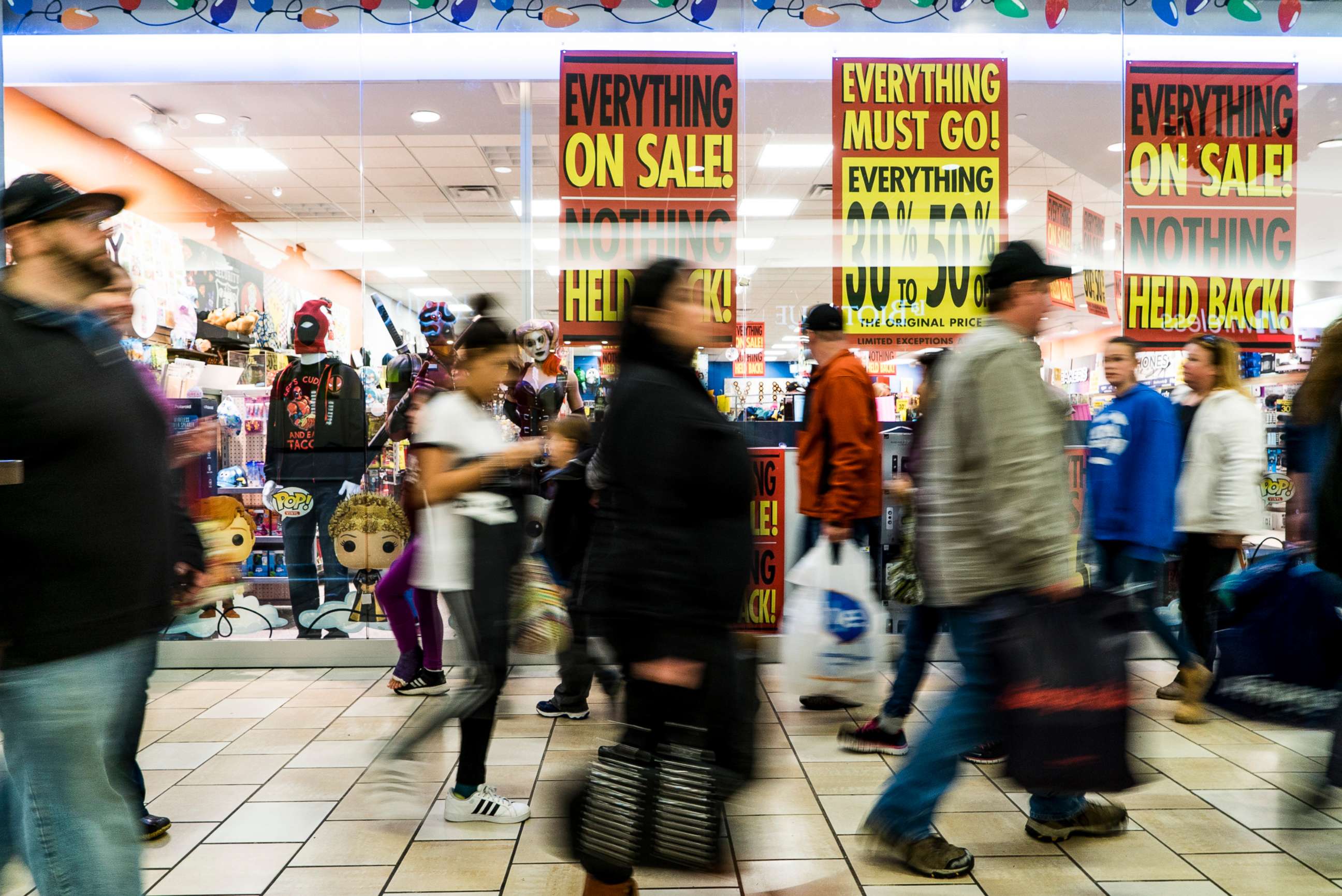PHOTO:Shoppers stream past advertisements for Black Friday sales at the Maine Mall in South Portland Friday, November 25, 2016.