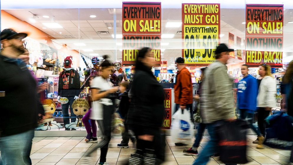 PHOTO:Shoppers stream past advertisements for Black Friday sales at the Maine Mall in South Portland Friday, November 25, 2016.