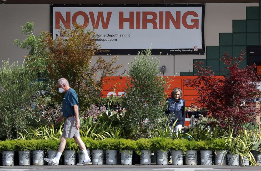 PHOTO: A "now hiring" sign is posted at a Home Depot store on Aug. 5, 2022, in San Rafael, Calif.