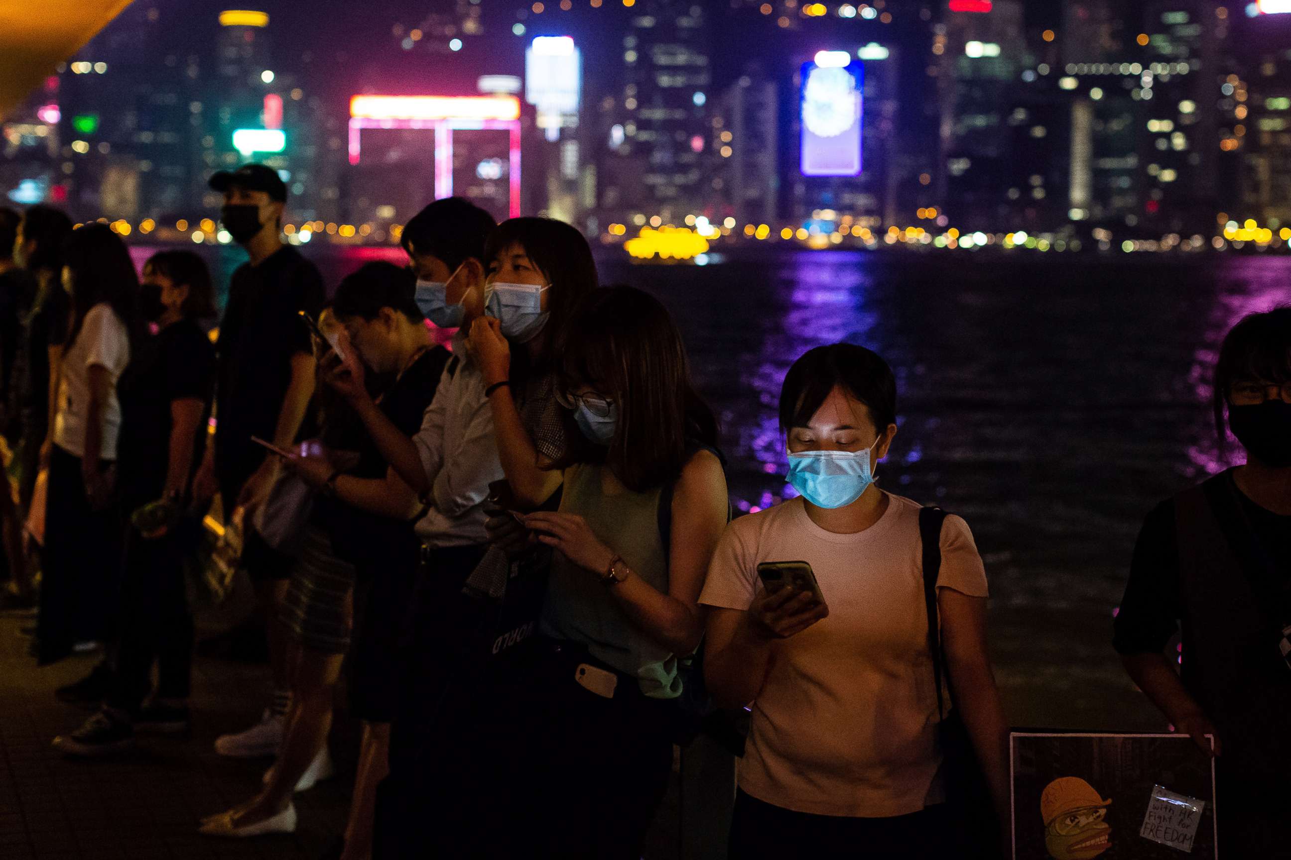 PHOTO: Demonstrators hold smartphones while forming a human chain during a protest in the Tsim Sha Tsui district of Hong Kong, Sept. 30, 2019.