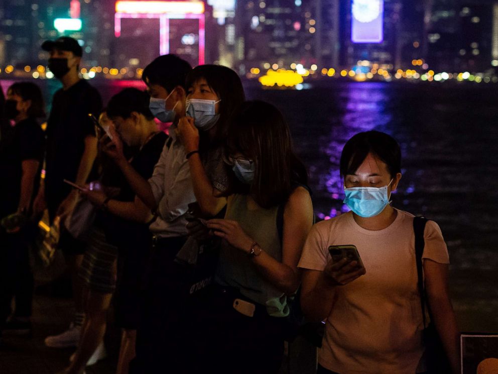 PHOTO: Demonstrators hold smartphones while forming a human chain during a protest in the Tsim Sha Tsui district of Hong Kong, Sept. 30, 2019.