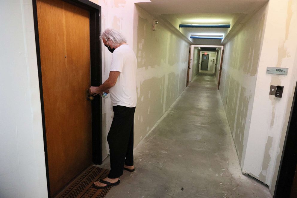 PHOTO: Jay Benter, who has lived at the Hamilton on the Bay apartment building for seven years, returns to his apartment after attending a protest against eviction notices in Miami, June 08, 2021.