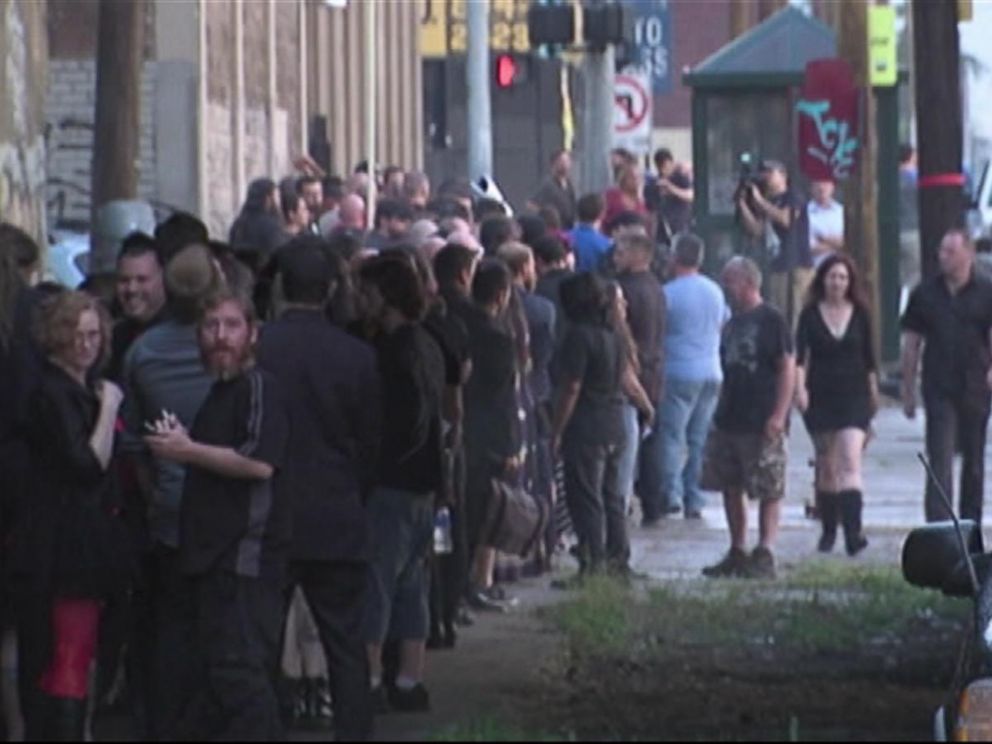 PHOTO: A crowd gathers and waits to participate in the unveiling event of a statue depicting Satan, July 25, 2015, organized by the Detroit Temple of Satan.