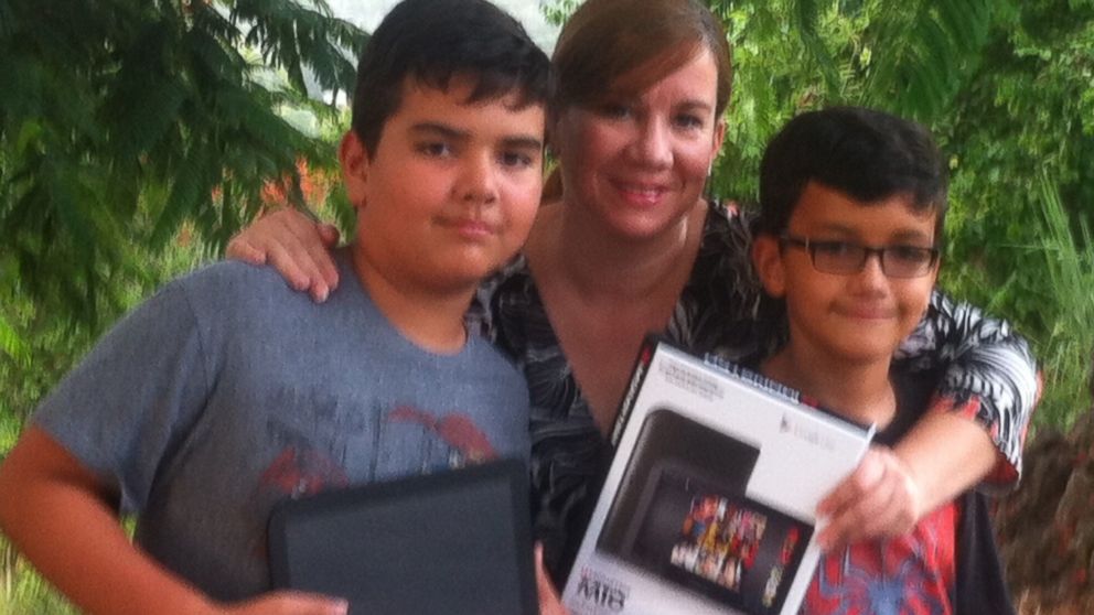 Mother Ada Reyes, seen her with her two sons, wrote to the ABC News Fixer to get some help with her Monster tablet.