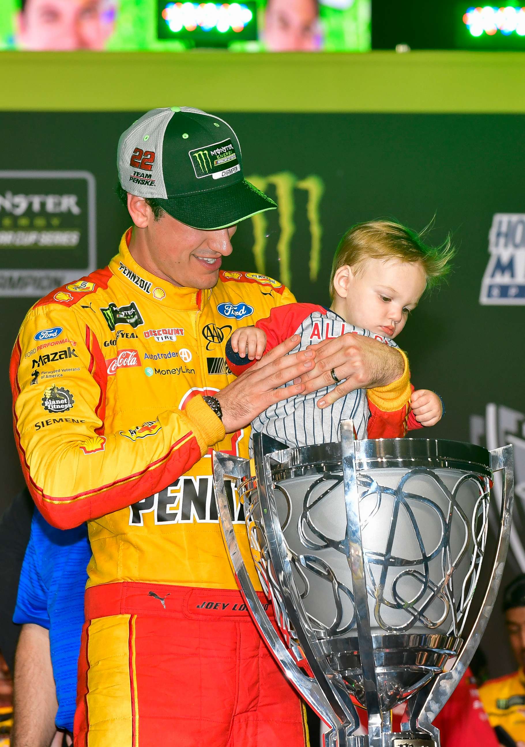 PHOTO: Joey Logano's son, Hudson, checking out the cup trophy. 
