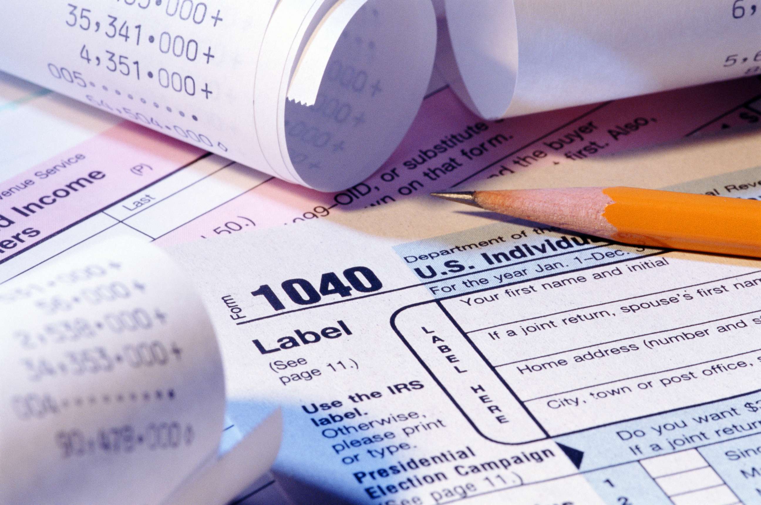 PHOTO: A tax form, receipts and pencil are pictured in this undated stock photo.