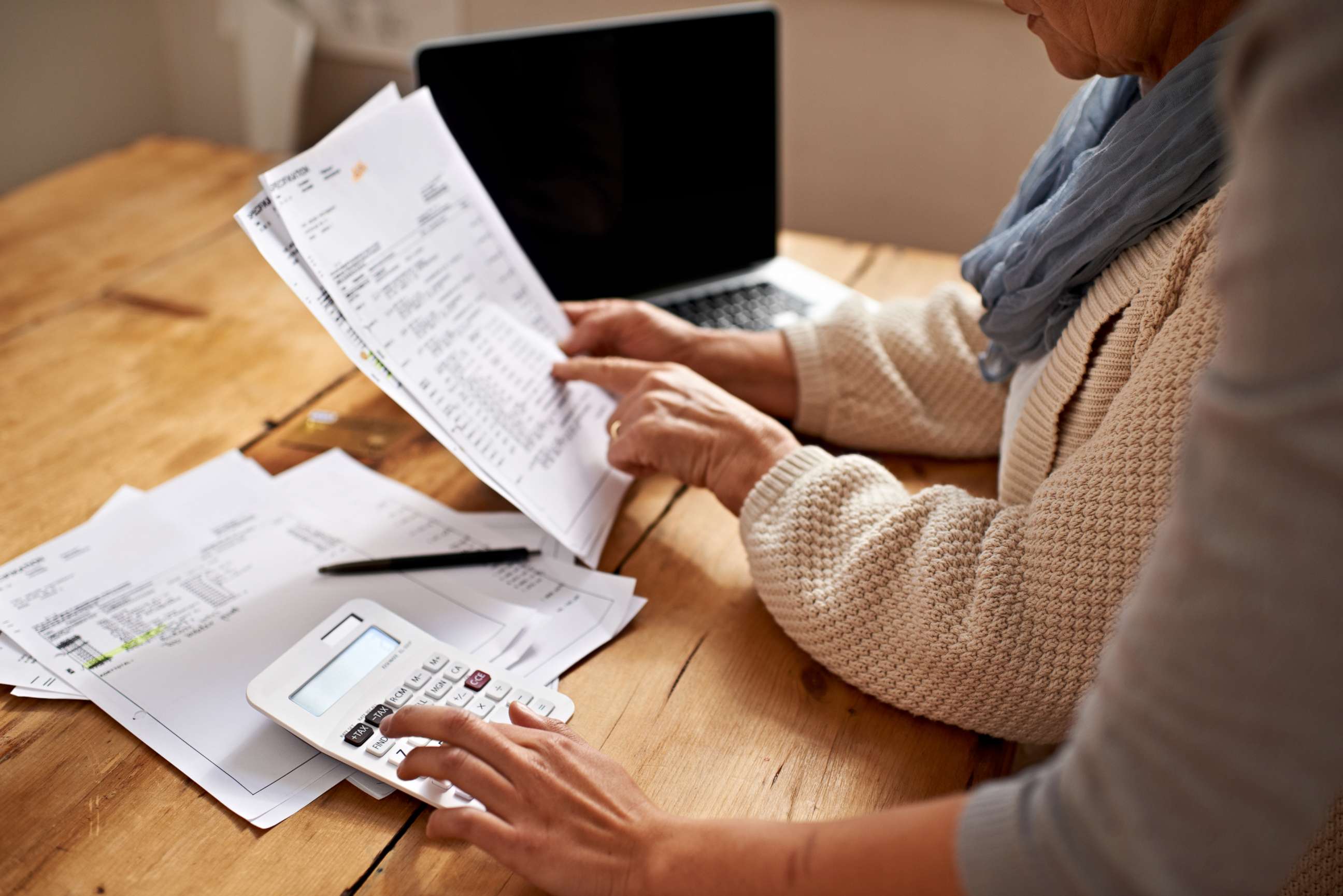 PHOTO: A senior woman receives help with her finances in this undated stock photo.