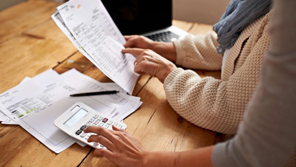 PHOTO: A senior woman receives help with her finances in this undated stock photo.