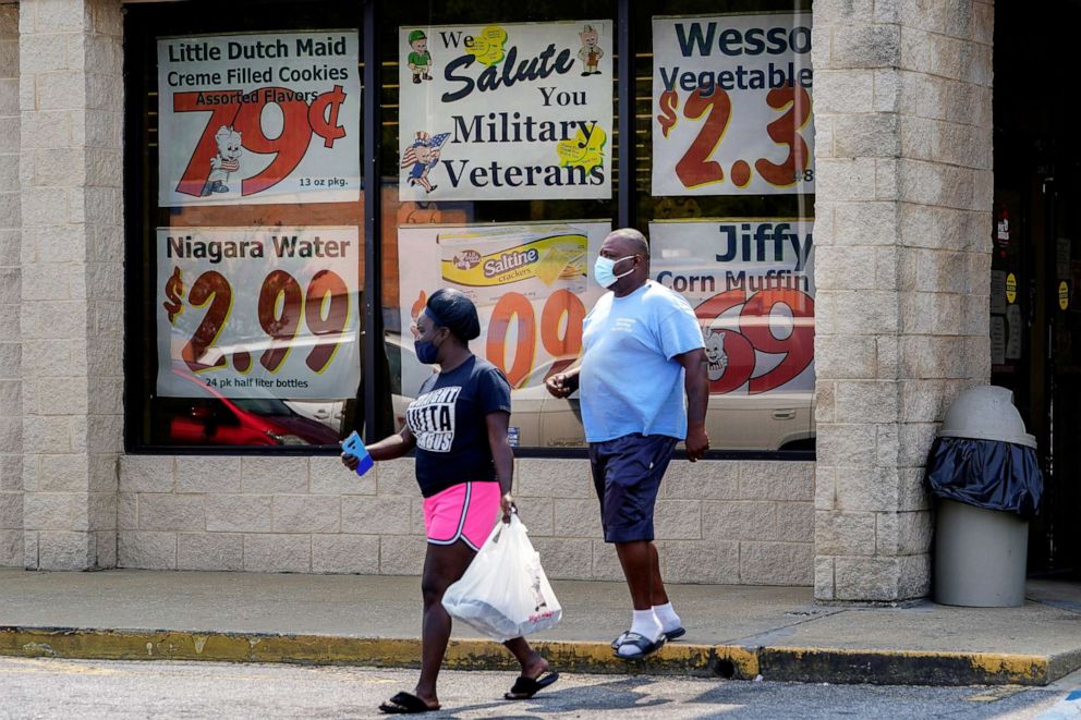 PHOTO: Shoppers leave a Piggly Wiggly supermarket in Columbus, Ga., Sept. 8, 2020.
