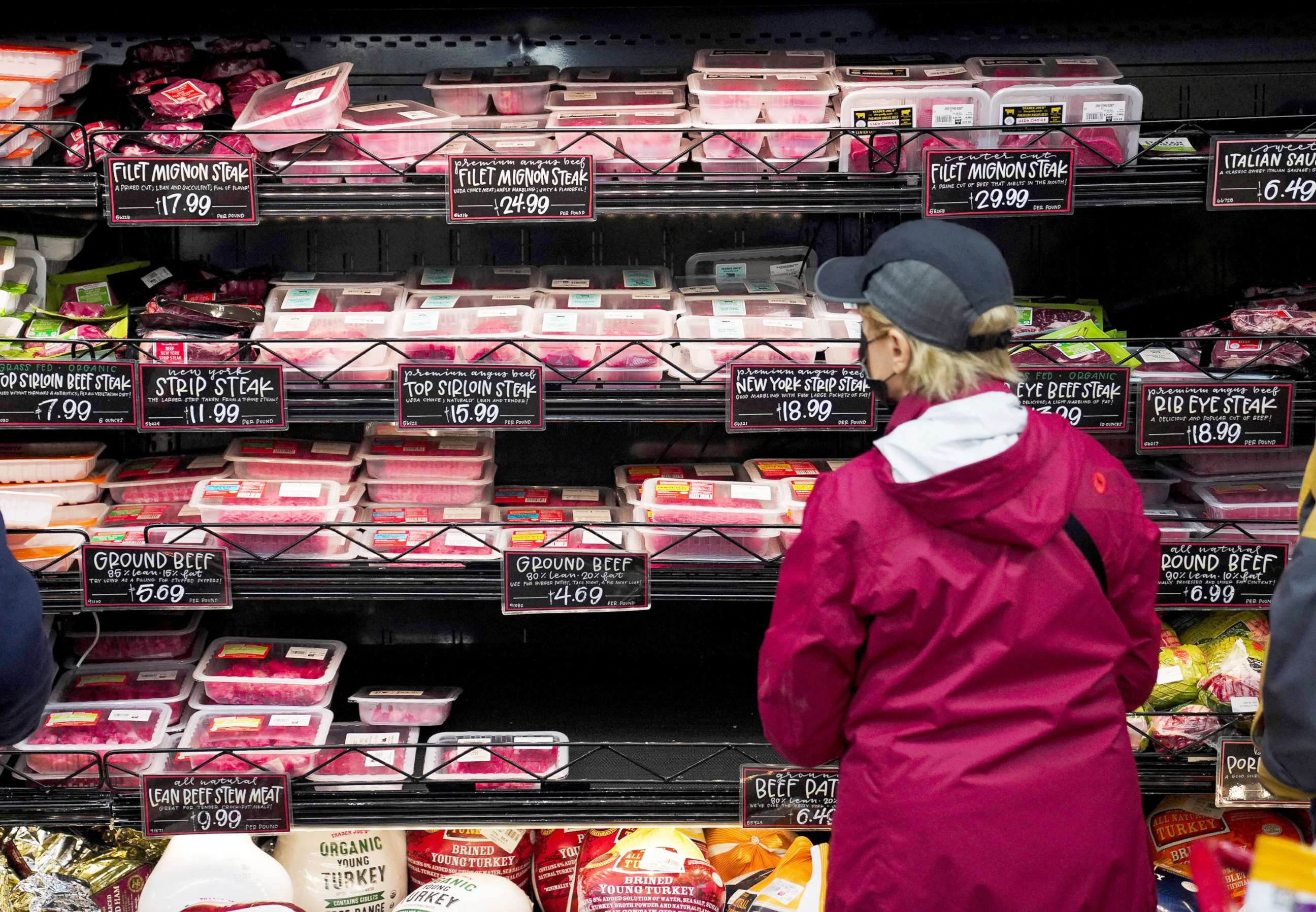 PHOTO: A customer selects meat at a grocery store in New York,  Nov. 14, 2021.  