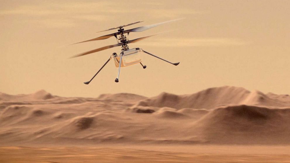 PHOTO: An artist's concept of NASA's Ingenuity Mars Helicopter flying through the Red Planet's skies.