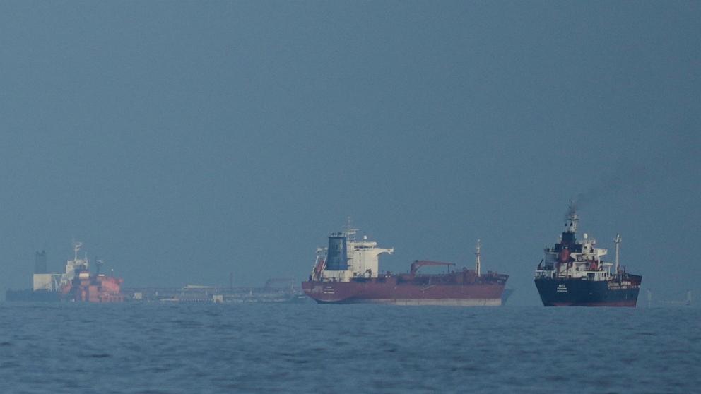 PHOTO: Oil tankers and cargo ships line up in the Strait of Hormuz as seen from Mina Al Fajer, United Arab Emirates, March 11, 2026.